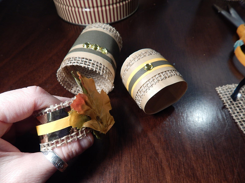 I even wrap the burlap around my napkins and made some napkin rings to match. Then I just added embellishments like Pro® Sheen strips and rhinestones from my local craft store. I even wrap the burlap around my napkins and made some napkin rings to match. Then I just added embellishments like Pro® Sheen strips and rhinestones from my local craft store.