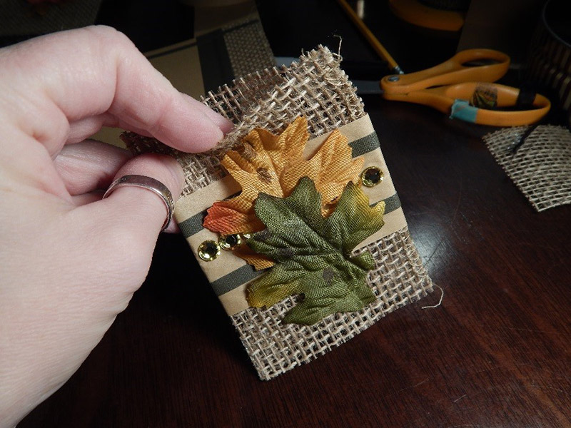 The utensil holders are just pieces of burlap folded in half like a birthday card. I secured the one longer end with UGlu®, leaving the top and bottom open so I can slip the utensils right in. Essentially, it’s like a pouch. The utensil holders are just pieces of burlap folded in half like a birthday card. I secured the one longer end with UGlu®, leaving the top and bottom open so I can slip the utensils right in. Essentially, it’s like a pouch.